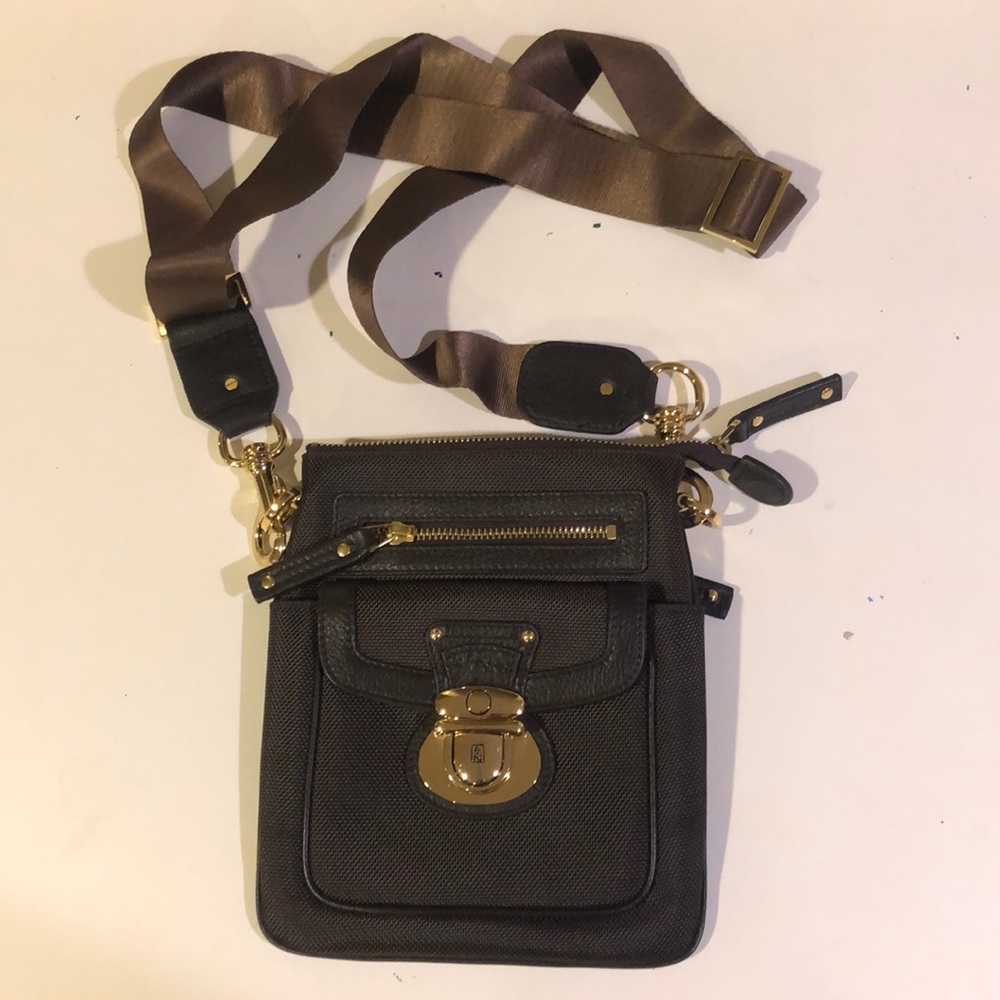 Brown cross body bag with gold hardware.
